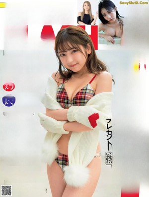 A woman in a black bra and panties posing for a picture.