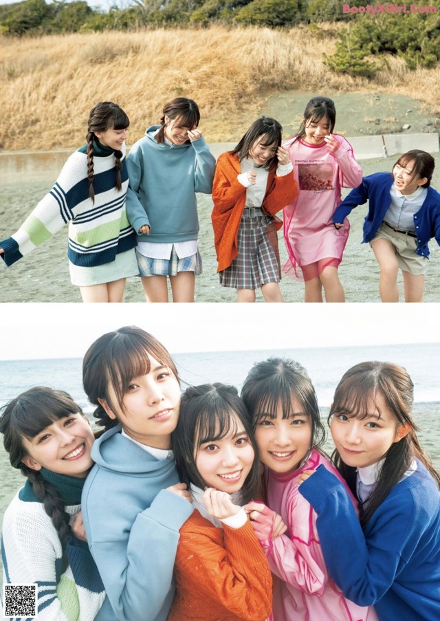 A group of young women standing next to each other on a beach.