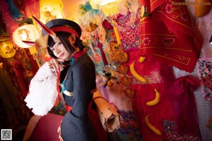 A woman dressed in a chinese costume posing for a picture.