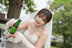 A woman crouching down on the ground with her legs crossed.