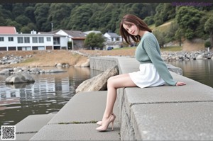 A woman in a purple and orange kimono sitting on the ground.