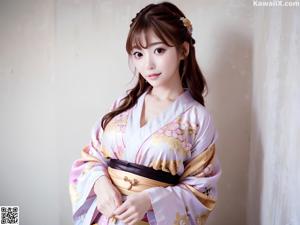 A woman in a kimono is posing for the camera.