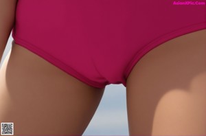 A woman in a pink bathing suit posing for a picture.