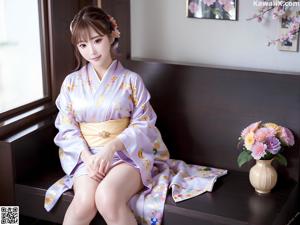 A woman in a purple kimono posing for a picture.