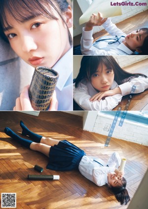 A woman laying on top of a wooden table next to a window.